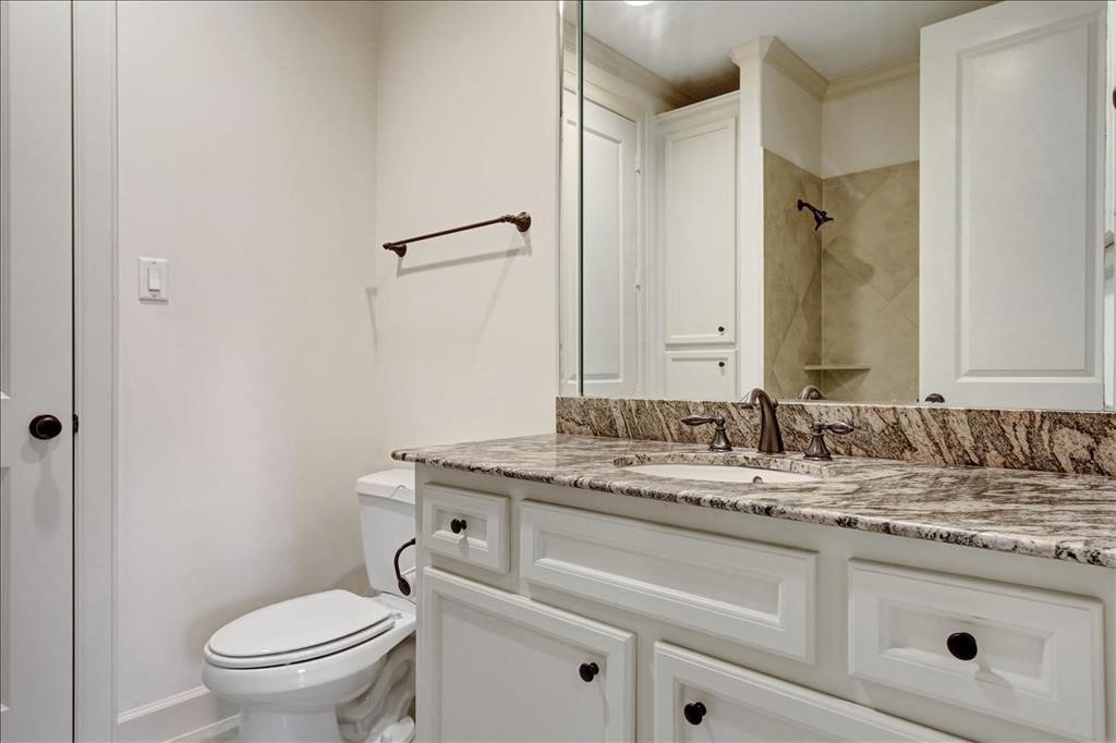 2318 Welch Street Houston, TX 77019 - Photo 9 of 35 Full bathroom down with oversize stone shower & granite counters