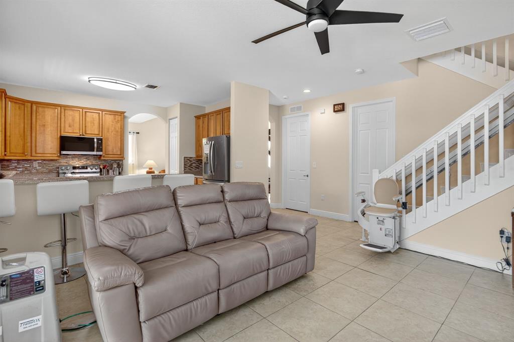 18203 Southwest 152nd Place Miami, FL 33187 - Photo 23 of 55 a living room with furniture and a flat screen tv
