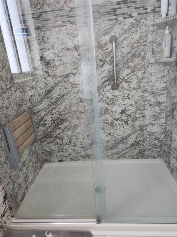 18203 Southwest 152nd Place Miami, FL 33187 - Photo 33 of 55 a bathroom with a shower