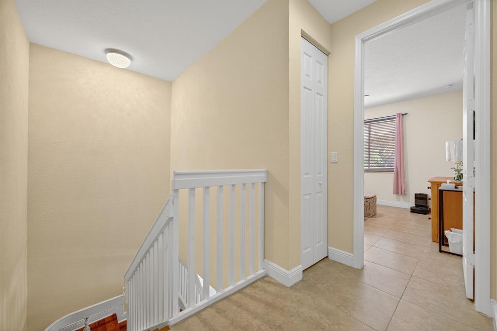 18203 Southwest 152nd Place Miami, FL 33187 - Photo 35 of 55 a view of a hallway with closet and a livingroom view