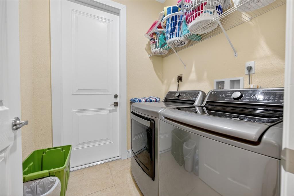 18203 Southwest 152nd Place Miami, FL 33187 - Photo 42 of 55 a kitchen with a sink and cabinets