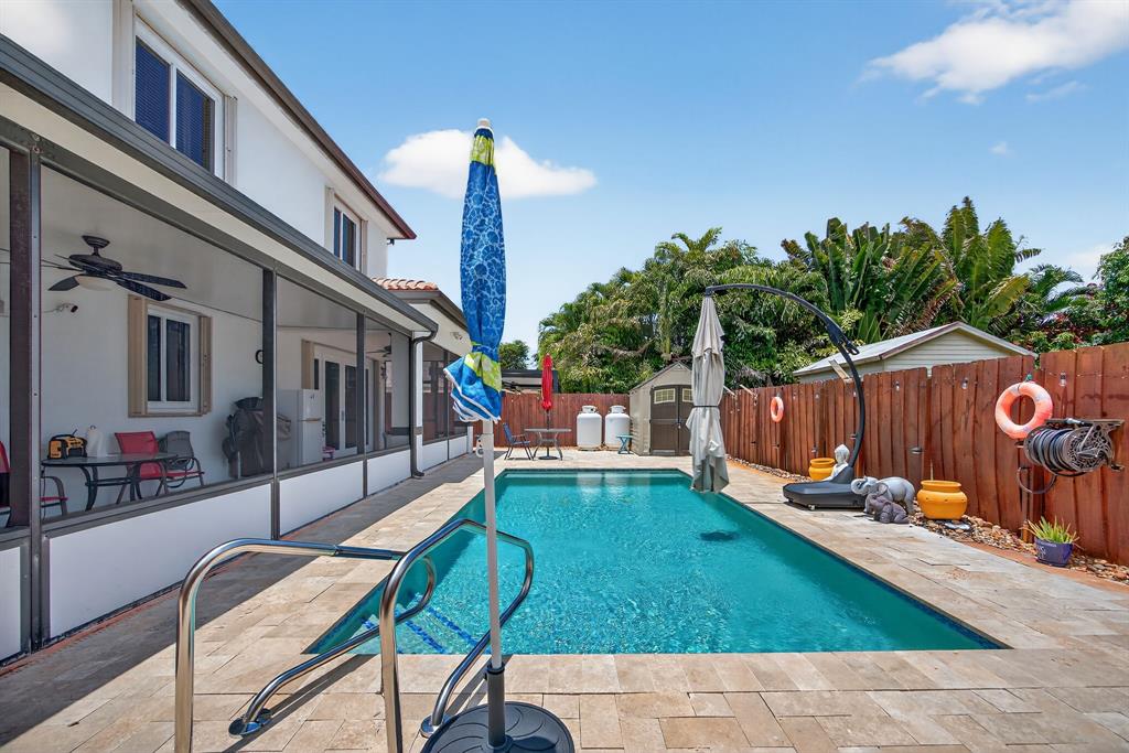 18203 Southwest 152nd Place Miami, FL 33187 - Photo 47 of 55 a view of an chairs and tables in the balcony