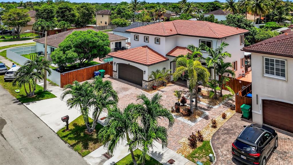 18203 Southwest 152nd Place Miami, FL 33187 - Photo 5 of 55 an aerial view of a house with yard swimming pool and outdoor seating