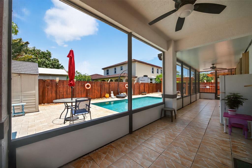 18203 Southwest 152nd Place Miami, FL 33187 - Photo 51 of 55 a outdoor space with the couches and a potted plant on the table