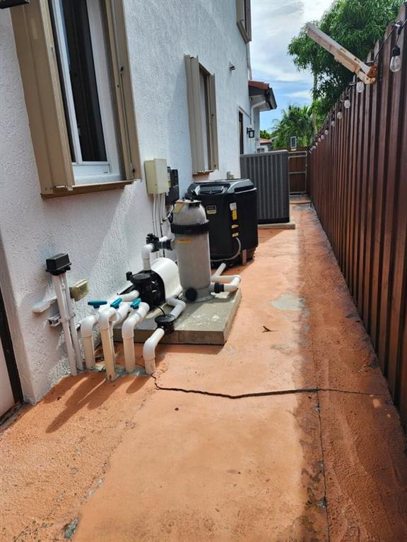 18203 Southwest 152nd Place Miami, FL 33187 - Photo 53 of 55 a gym equipment sitting on top of a kitchen