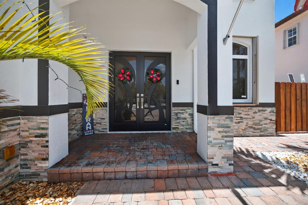 18203 Southwest 152nd Place Miami, FL 33187 - Photo 10 of 55 a view of a entryway door front of house