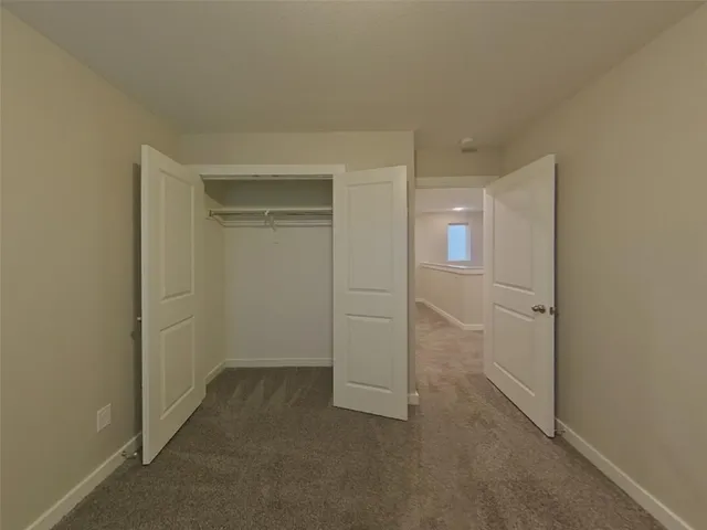 an empty room with a bathroom