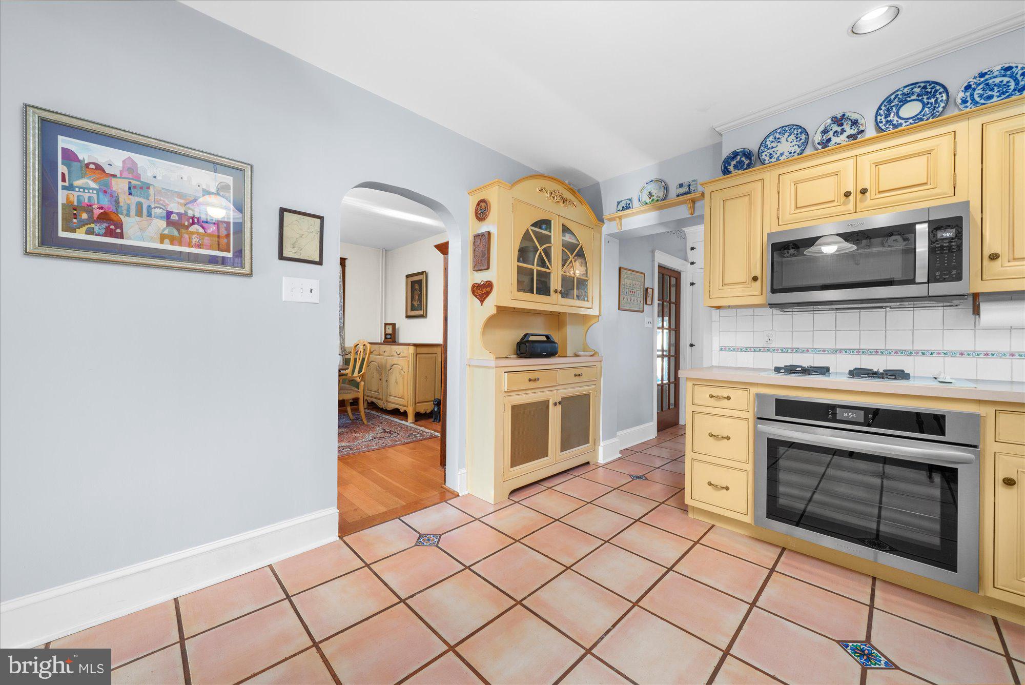 3 Reading Avenue Reading, PA 19607 - Photo 12 of 44 a kitchen with stainless steel appliances granite countertop a stove and a microwave