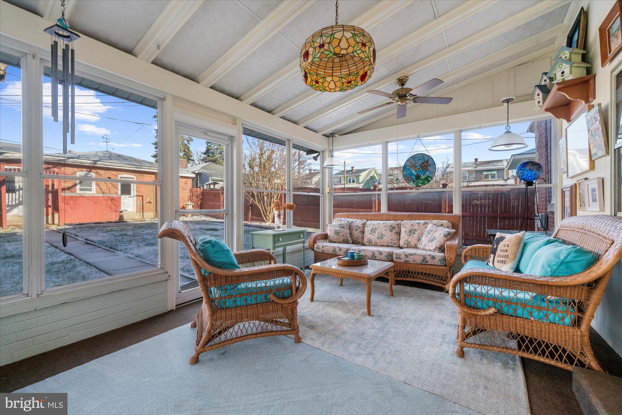 3 Reading Avenue Reading, PA 19607 - Photo 30 of 44 a living room with furniture a fireplace and a floor to ceiling window