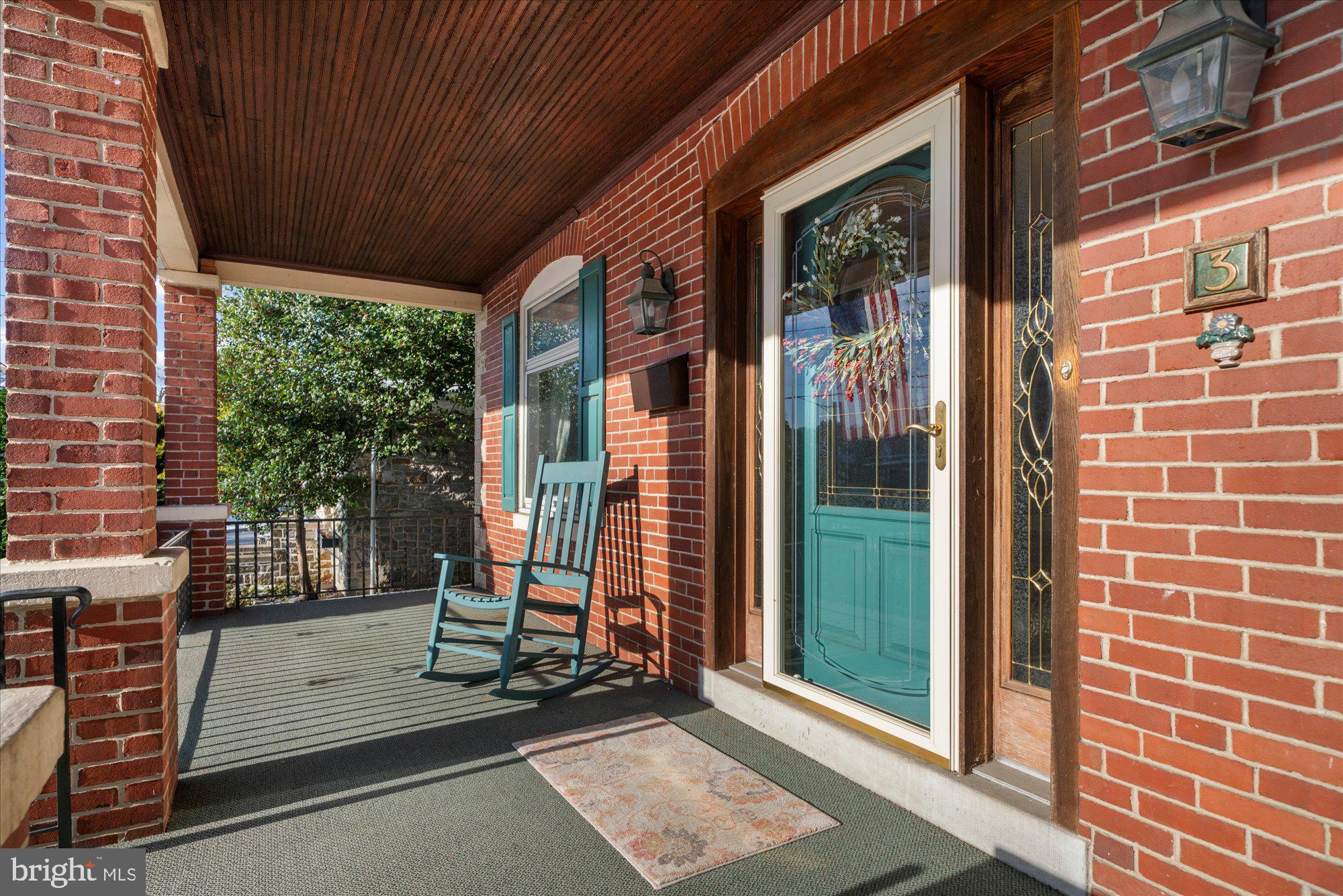 3 Reading Avenue Reading, PA 19607 - Photo 3 of 44 a view of a porch with a table and chairs