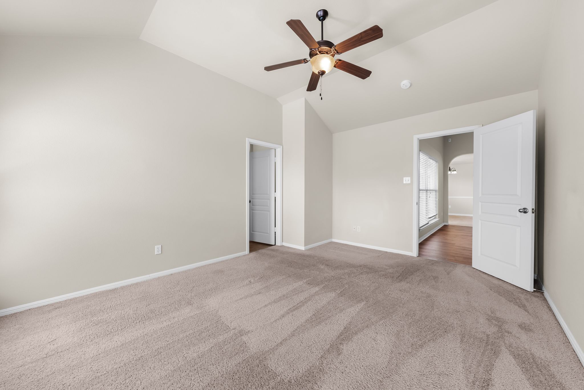 7719 Fieldstone Drive Temple, TX 76502 - Photo 24 of 37 Unfurnished bedroom featuring a ceiling fan, lofted ceiling, and carpet flooring