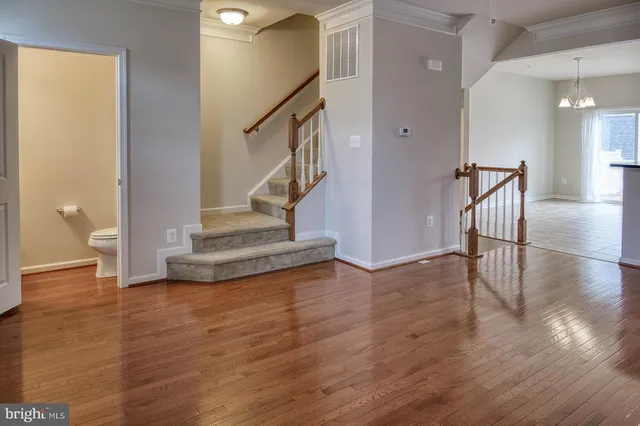 a view of an entryway with wooden floor