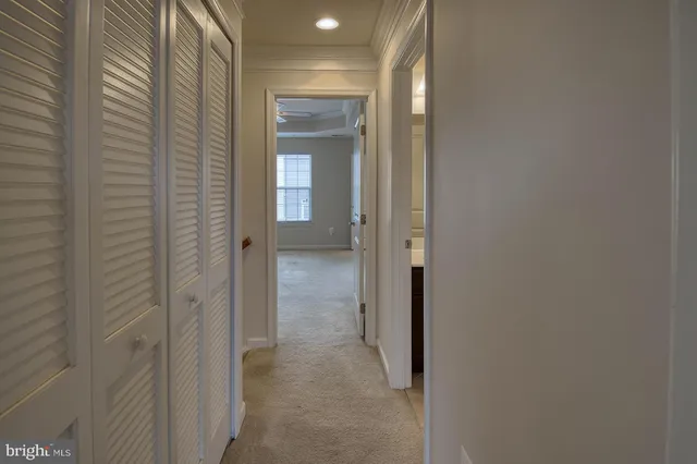 a view of a bathroom from a hallway