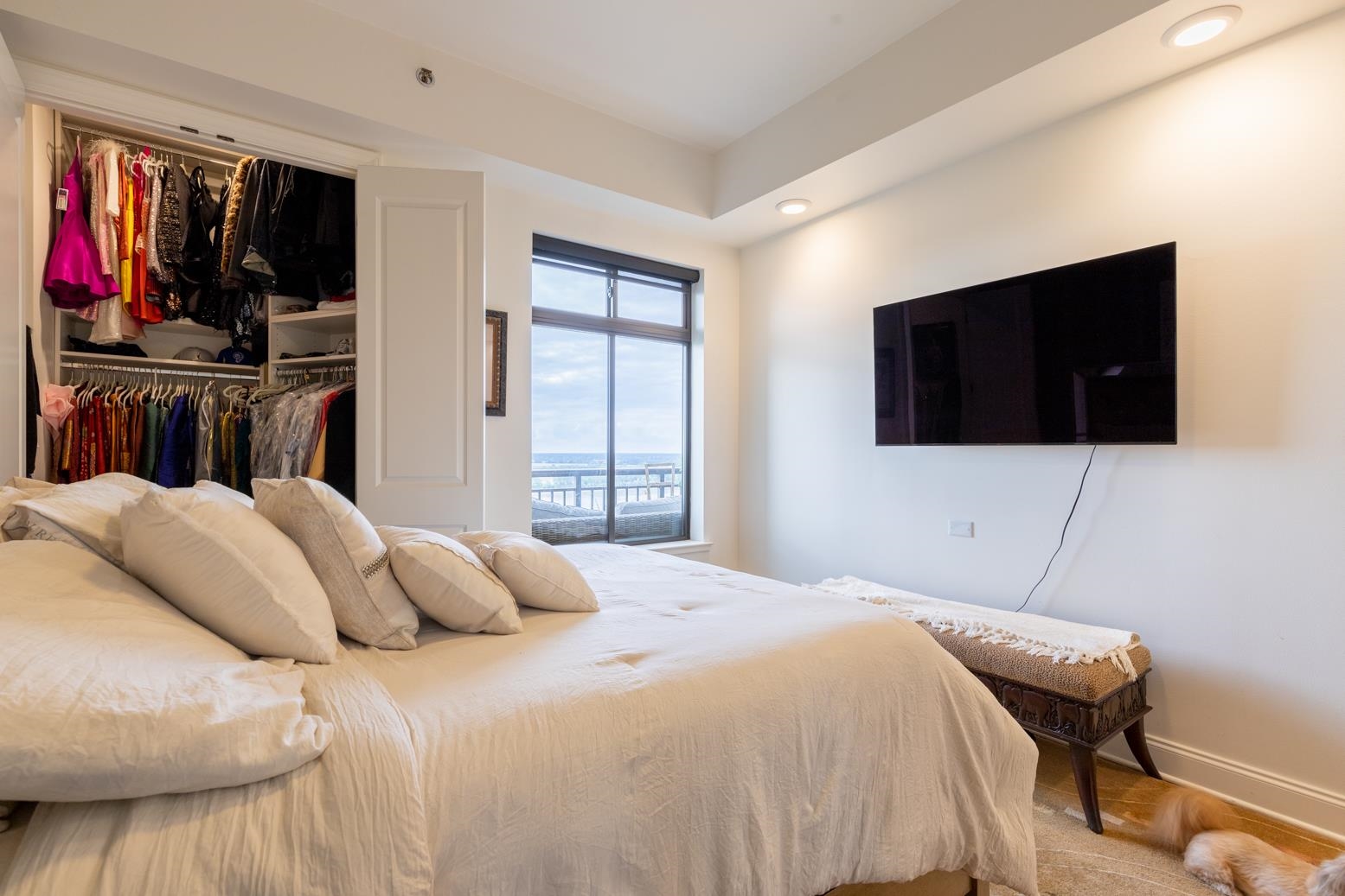 717 Riverside Drive, Unit 1407 Memphis, TN 38103 - Photo 18 of 39 Primary bedroom with gorgeous views and two walk in closets.