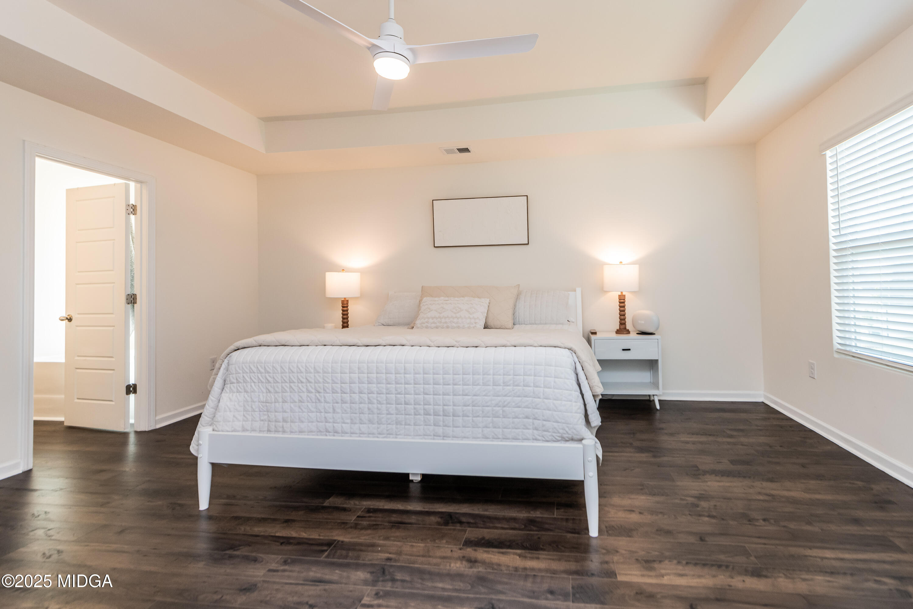 126 Farmers Way Perry, GA 31069 - Photo 12 of 33 a bedroom with a bed and a night stand