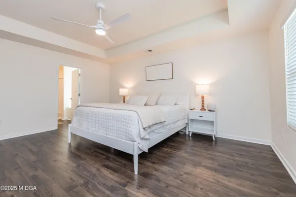 a bedroom with a bed and a table