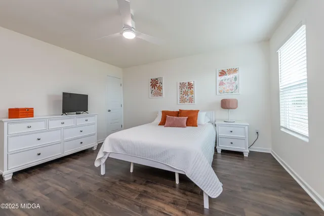 a room with a bed and a window