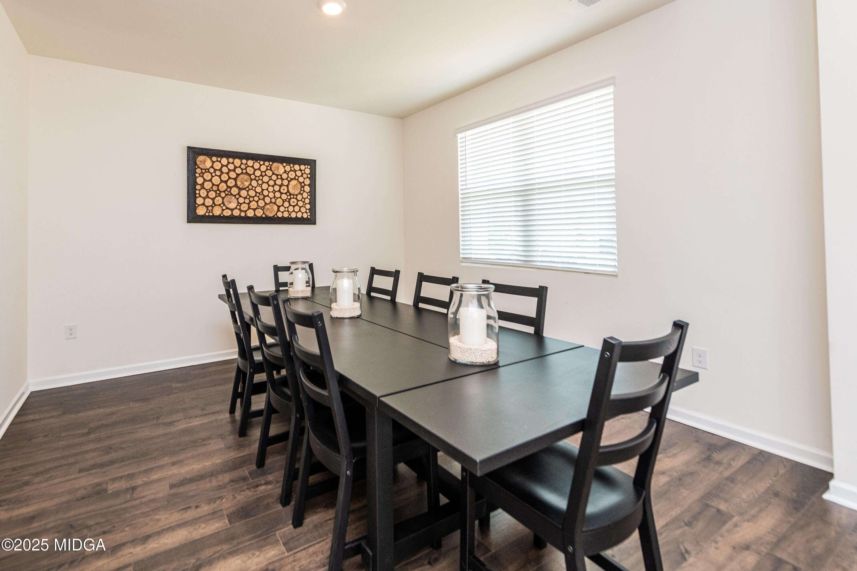 126 Farmers Way Perry, GA 31069 - Photo 2 of 33 a view of a dining room with furniture and wooden floor