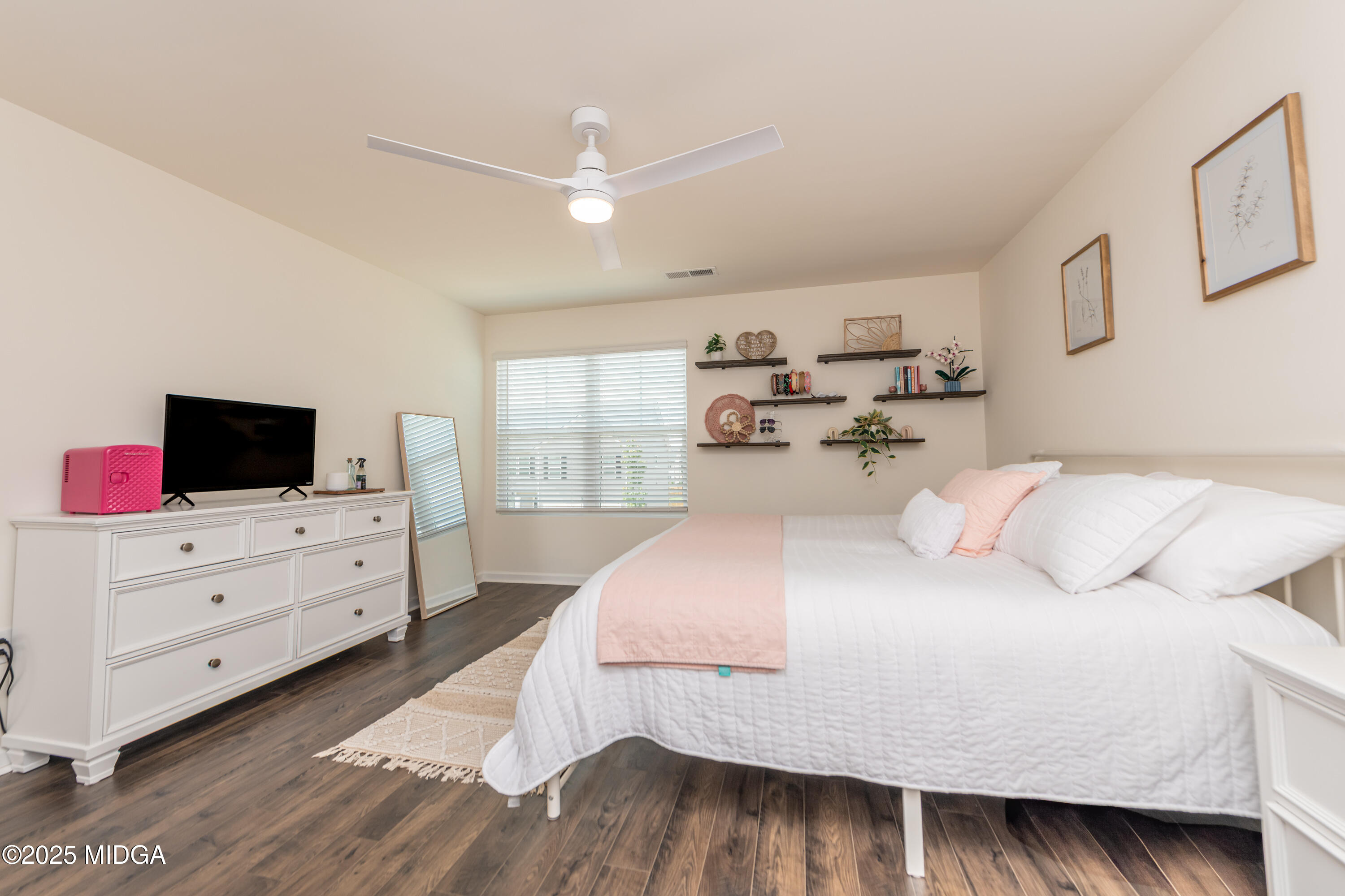 126 Farmers Way Perry, GA 31069 - Photo 27 of 33 a bedroom with a bed and a flat screen tv