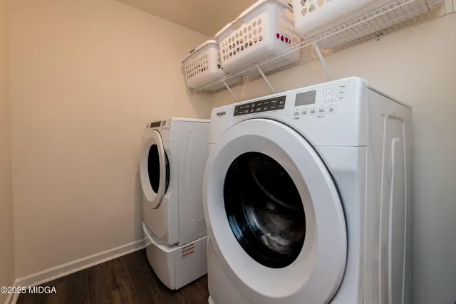 a utility room with dryer and washer