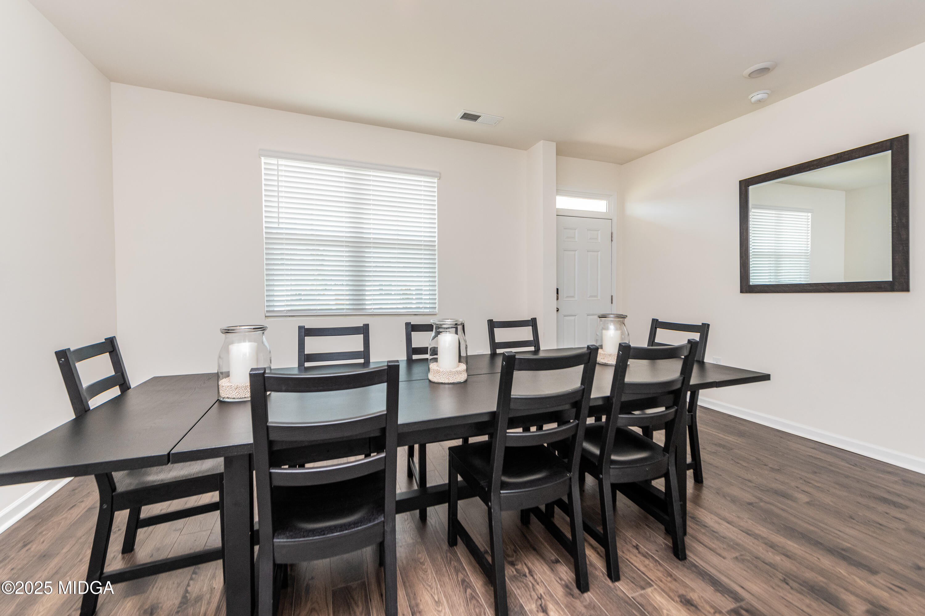 126 Farmers Way Perry, GA 31069 - Photo 3 of 33 a view of a dining room with furniture and wooden floor