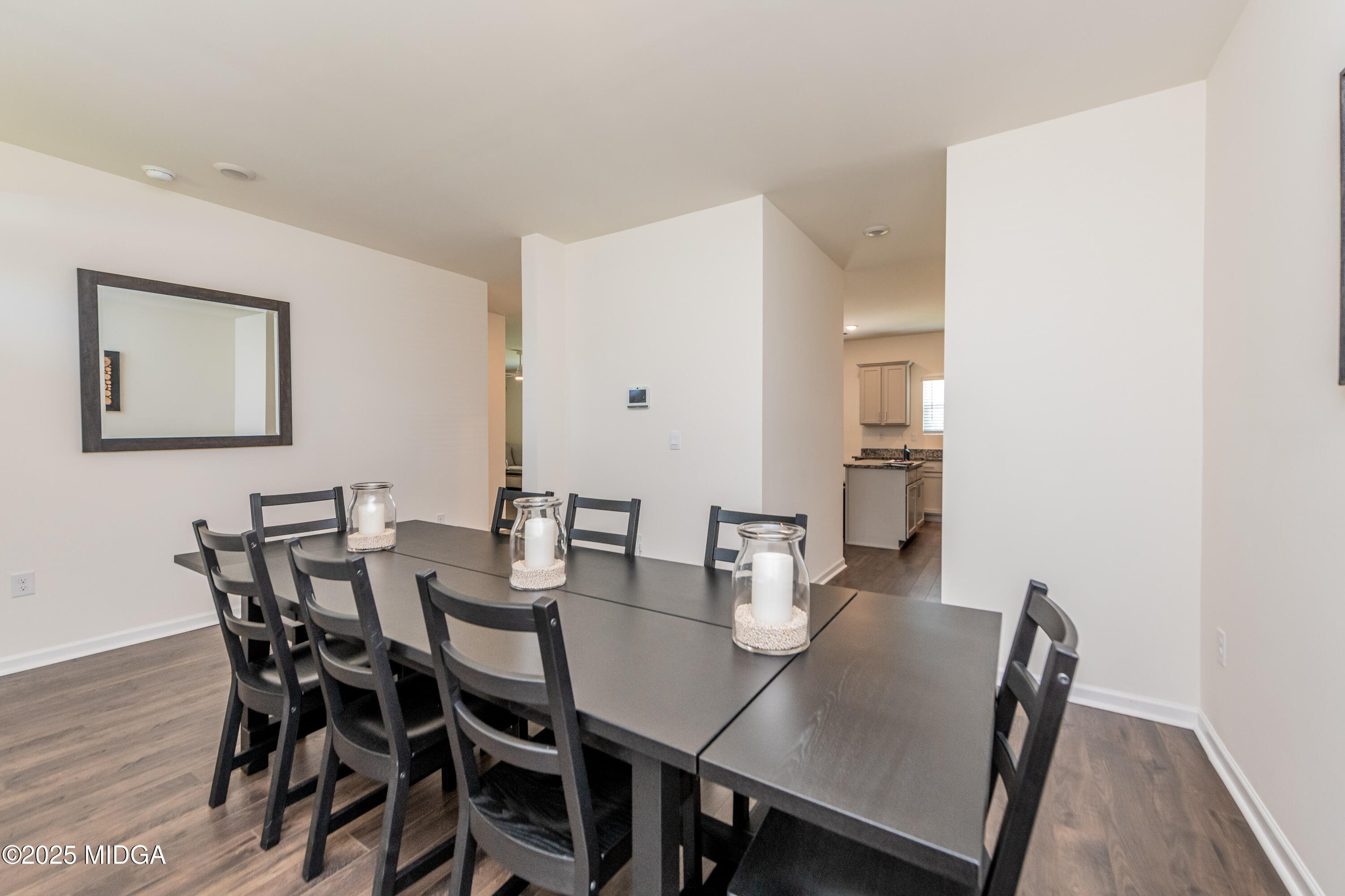 126 Farmers Way Perry, GA 31069 - Photo 4 of 33 a view of a dining room with furniture and wooden floor