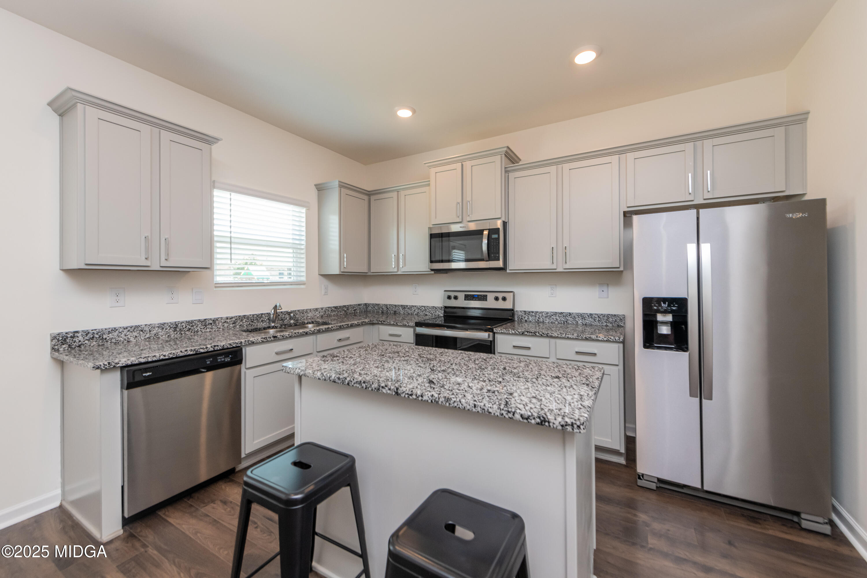126 Farmers Way Perry, GA 31069 - Photo 7 of 33 a kitchen with stainless steel appliances granite countertop a refrigerator a stove a sink and a microwave