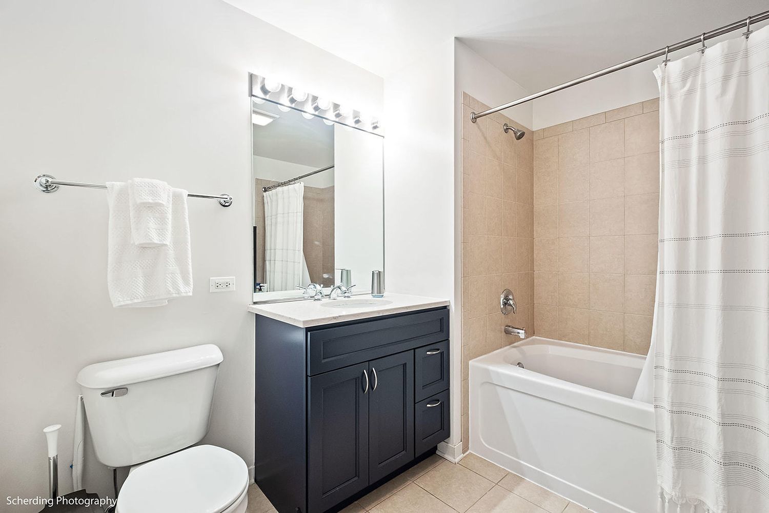 437 West Division Street, Unit 806 Chicago, IL 60610 - Photo 11 of 18 a bathroom with a granite countertop sink toilet and shower