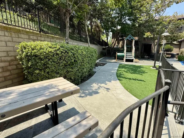 a view of a backyard with chairs