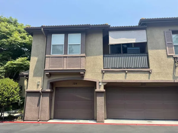 a front view of a house with garage