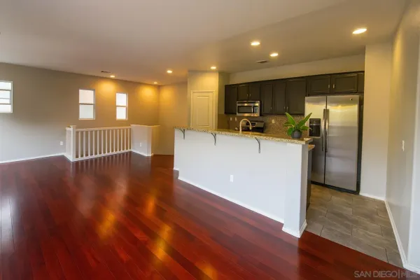 a view of kitchen with cabinets and stainless steel appliances