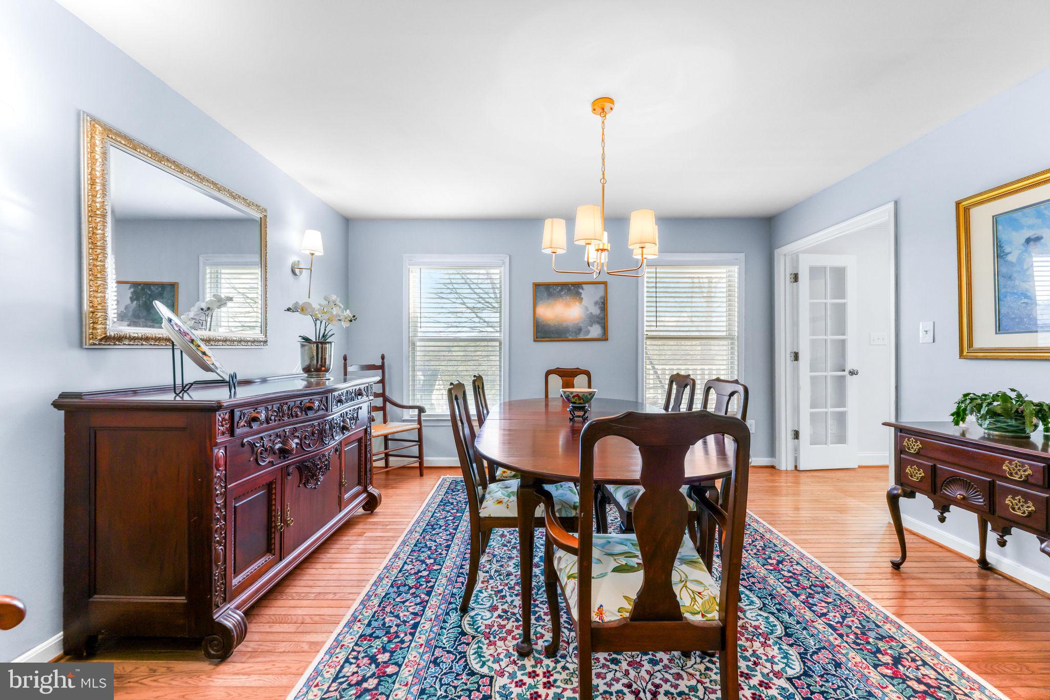 21310 West Liberty Road Parkton, MD 21120 - Photo 19 of 111 a view of a dining room with furniture and wooden floor