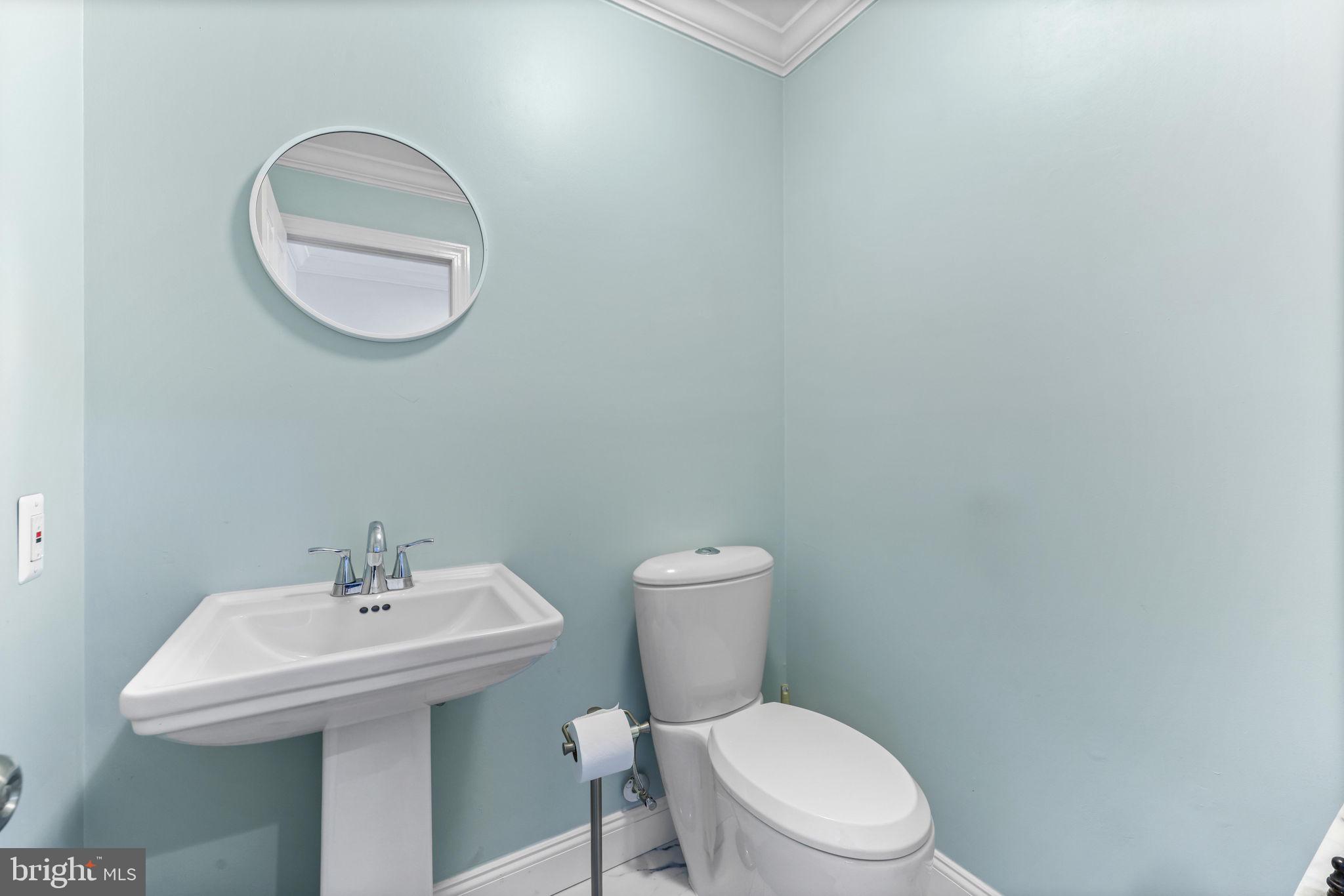 21310 West Liberty Road Parkton, MD 21120 - Photo 22 of 111 a white toilet sitting next to a bathroom sink
