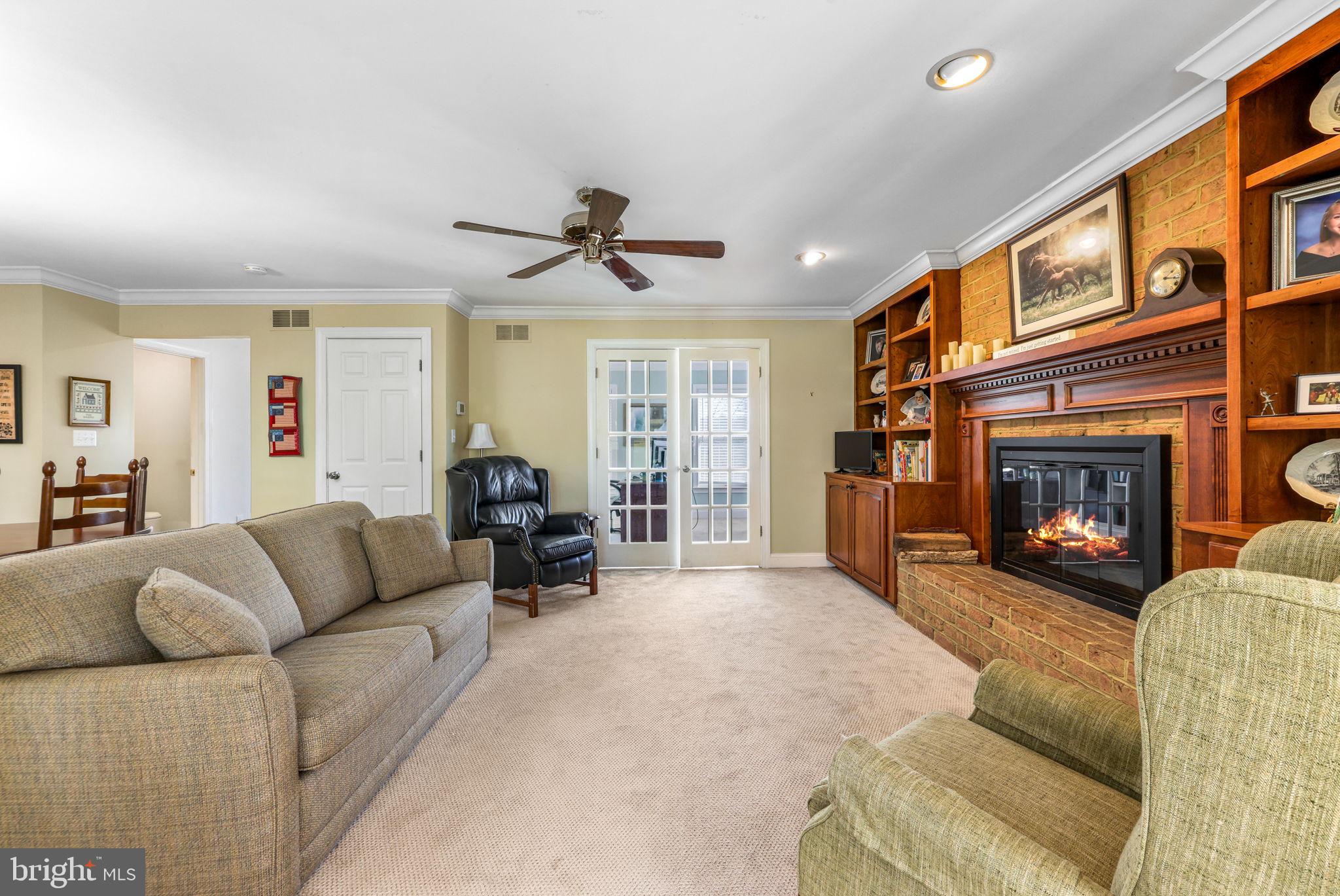 21310 West Liberty Road Parkton, MD 21120 - Photo 30 of 111 a living room with furniture a window and a fireplace