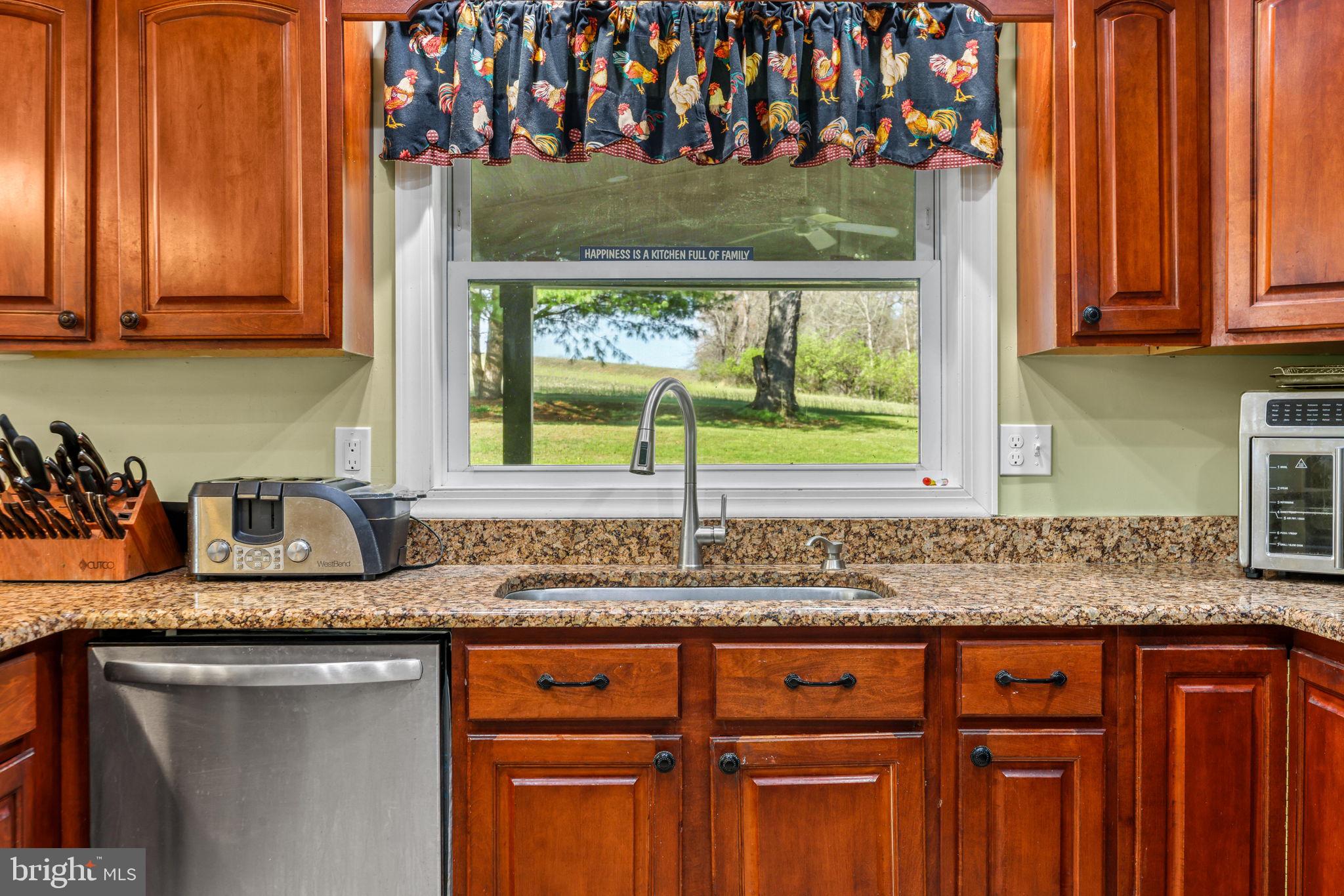 21310 West Liberty Road Parkton, MD 21120 - Photo 34 of 111 a kitchen with stainless steel appliances granite countertop a sink a stove and cabinets