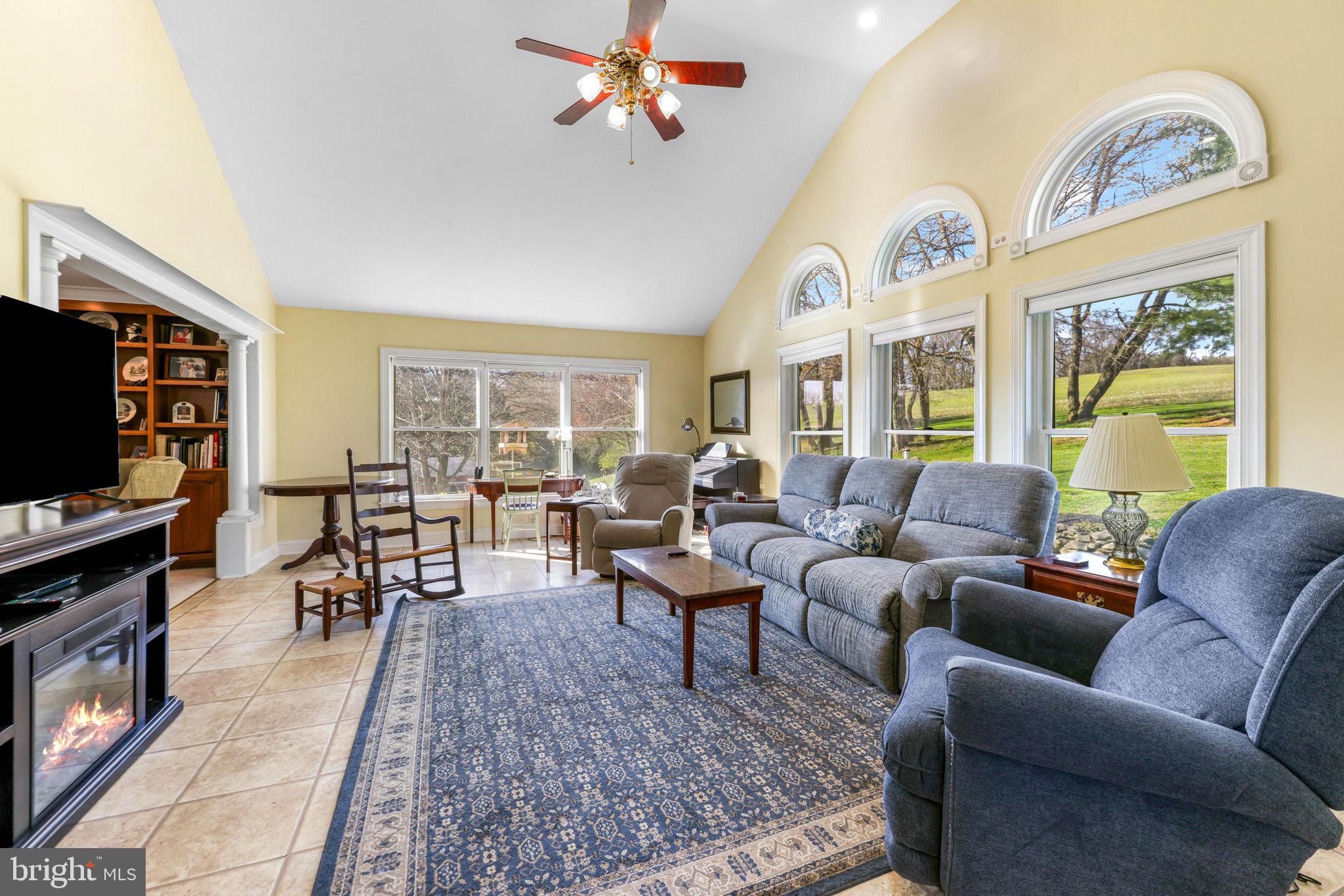 21310 West Liberty Road Parkton, MD 21120 - Photo 6 of 111 a living room with furniture a flat screen tv and a window