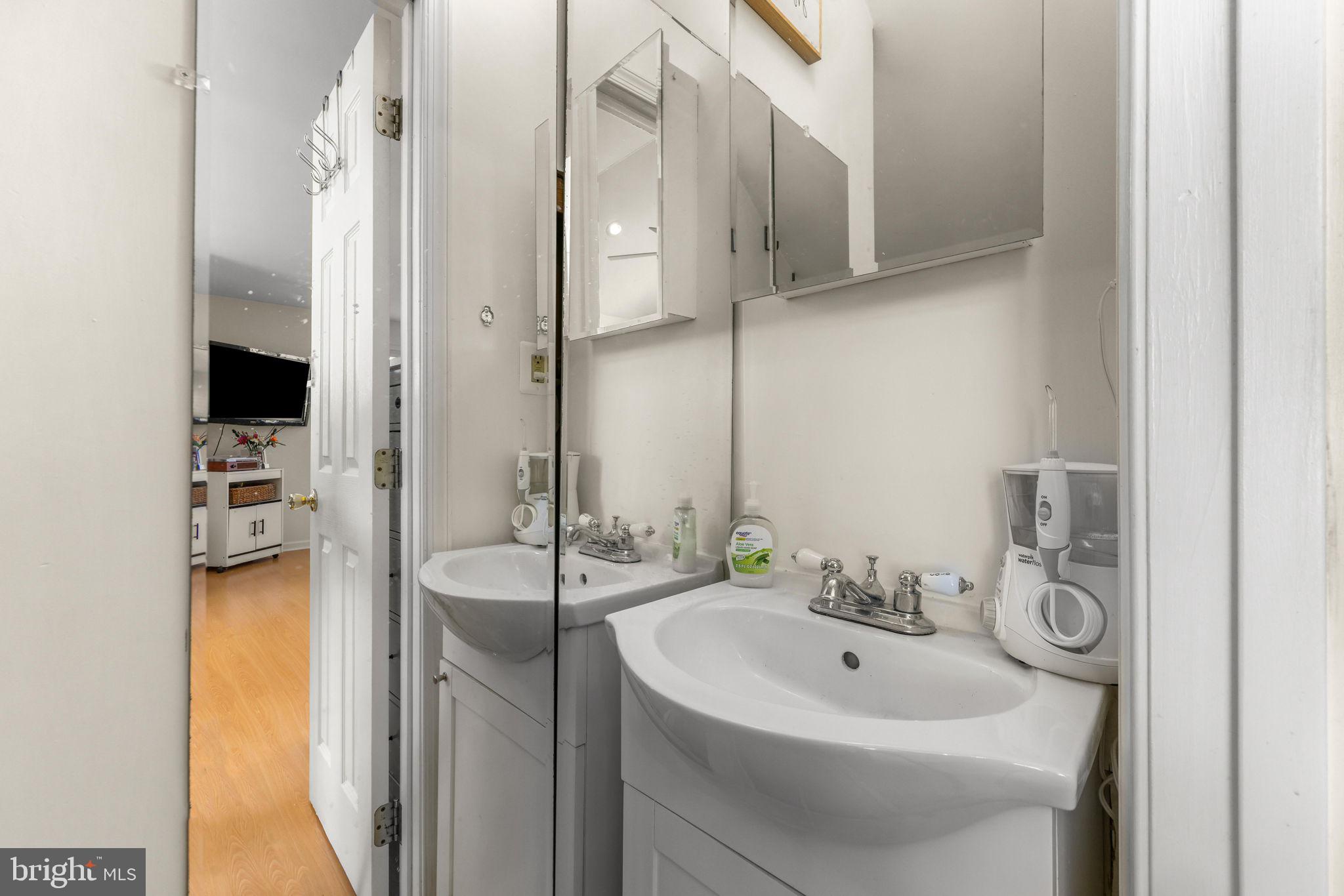 21310 West Liberty Road Parkton, MD 21120 - Photo 61 of 111 a bathroom with a sink and a mirror