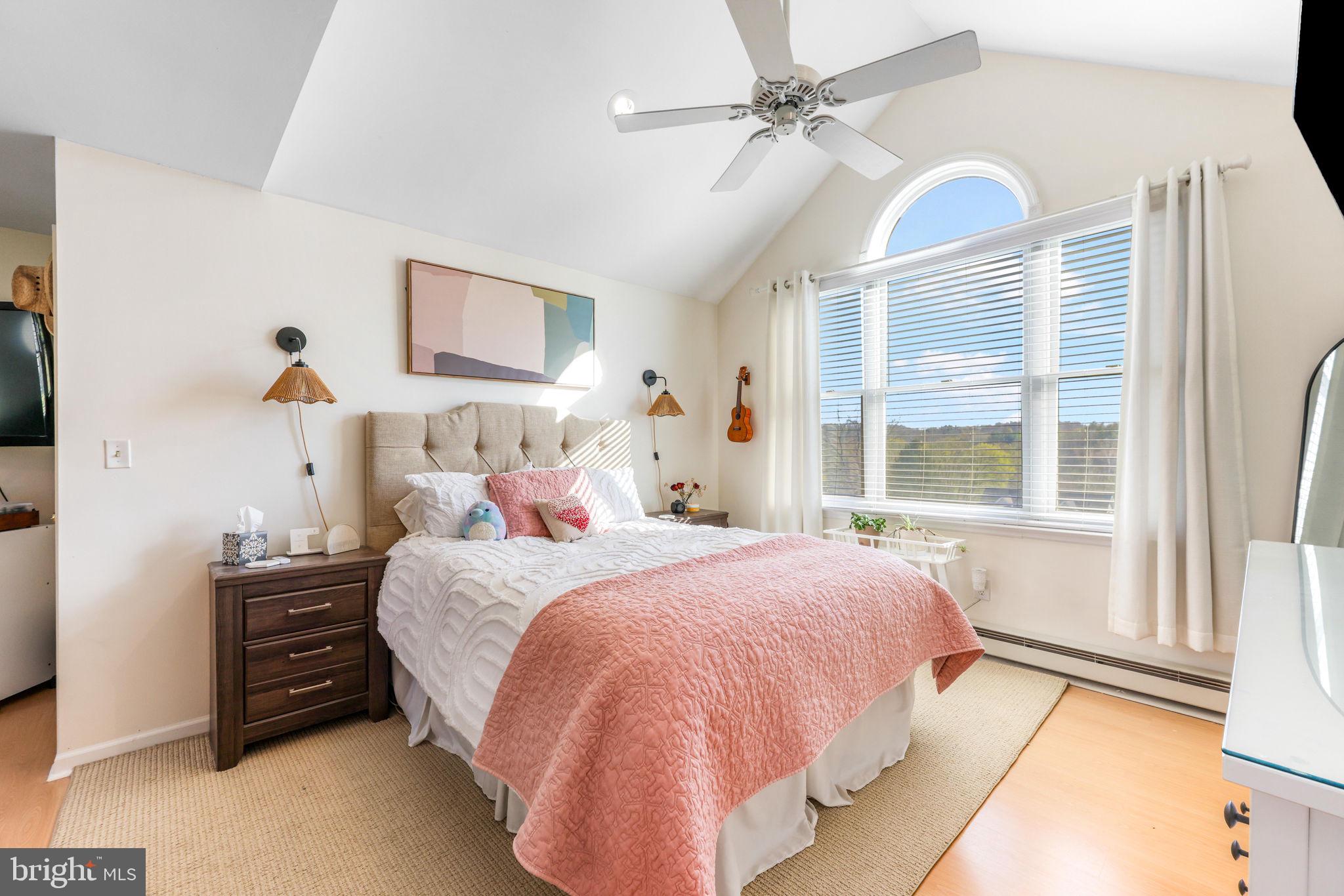 21310 West Liberty Road Parkton, MD 21120 - Photo 63 of 111 a bedroom with a bed next to a window and a chandelier