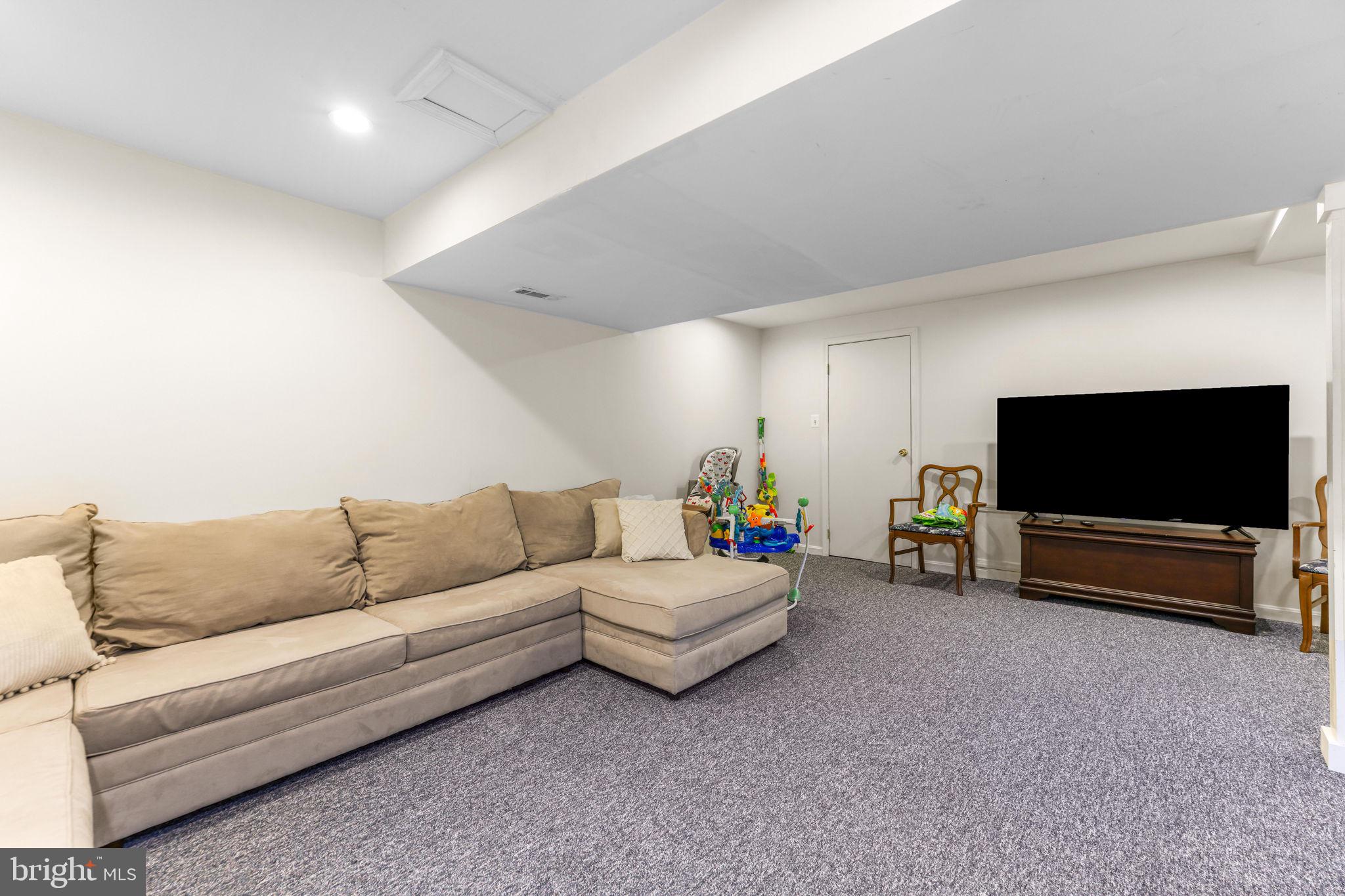 21310 West Liberty Road Parkton, MD 21120 - Photo 77 of 111 a living room with furniture and a flat screen tv