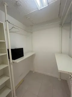 a view of an empty walk in closet