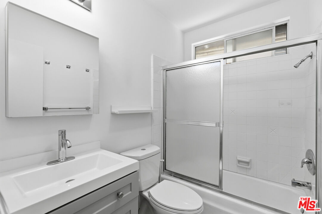 1434 25th Street, Unit 2 Santa Monica, CA 90404 - Photo 17 of 26 a bathroom with a sink toilet and shower