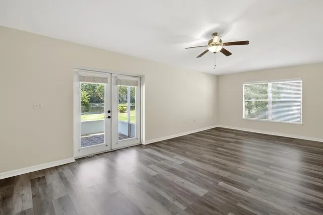 a wooden bench sitting in front of a building