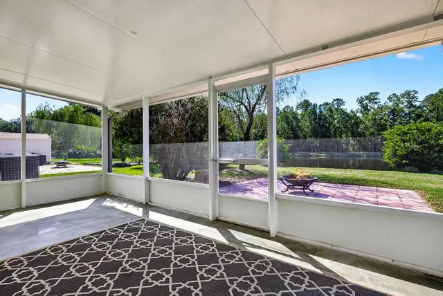 an aerial view of residential houses with outdoor space and river