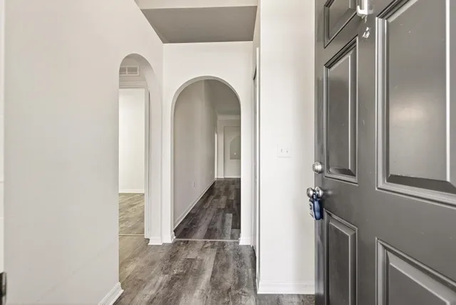 a bedroom with a large bed and a couch