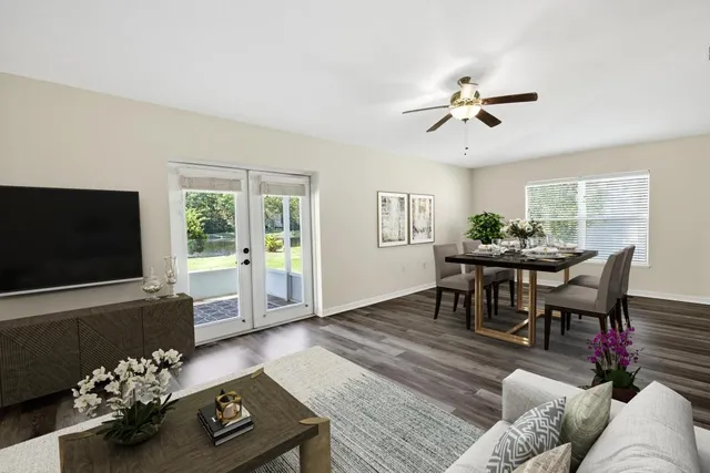 a view of empty room with wooden floor and window