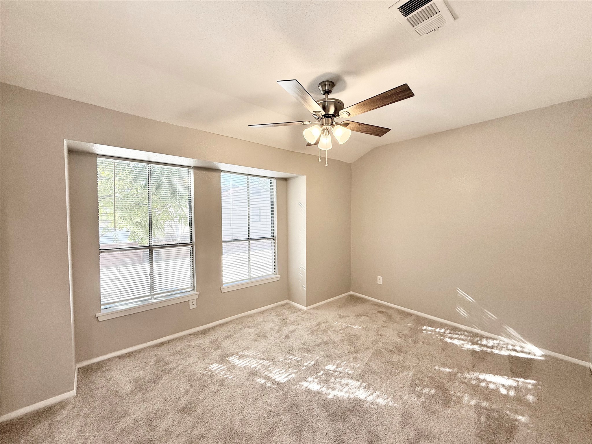 7980 Grove Ridge Drive Houston, TX 77061 - Photo 13 of 19 Second Bedroom with new carpet throughout and sunscreens on the west-facing windows