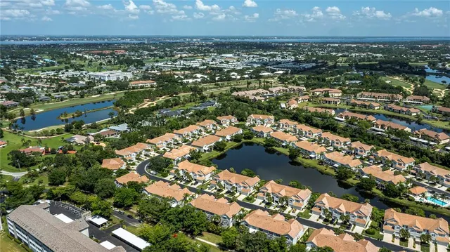 an aerial view of residential houses with city view
