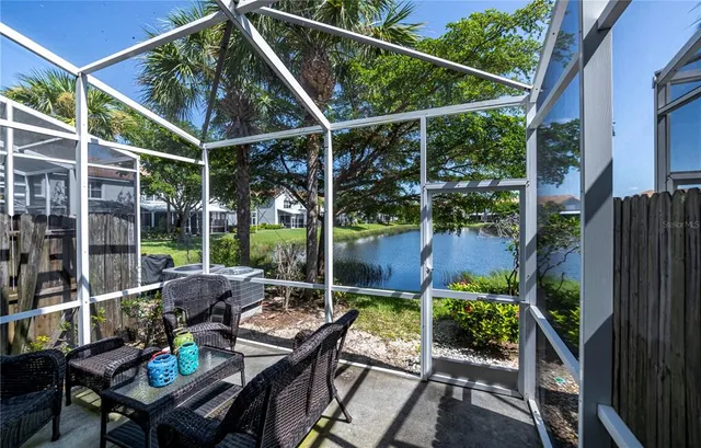 a view of a lake with a house in the background