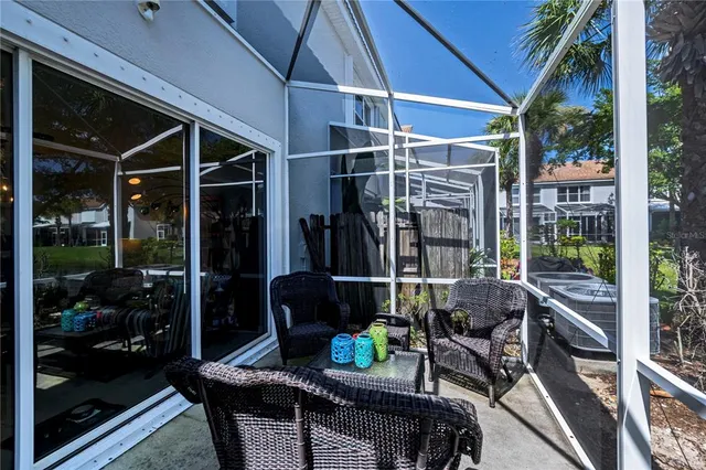 an aerial view of a house with garden space and a lake view