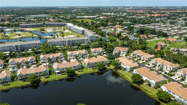 an aerial view of a house with garden space ocean view